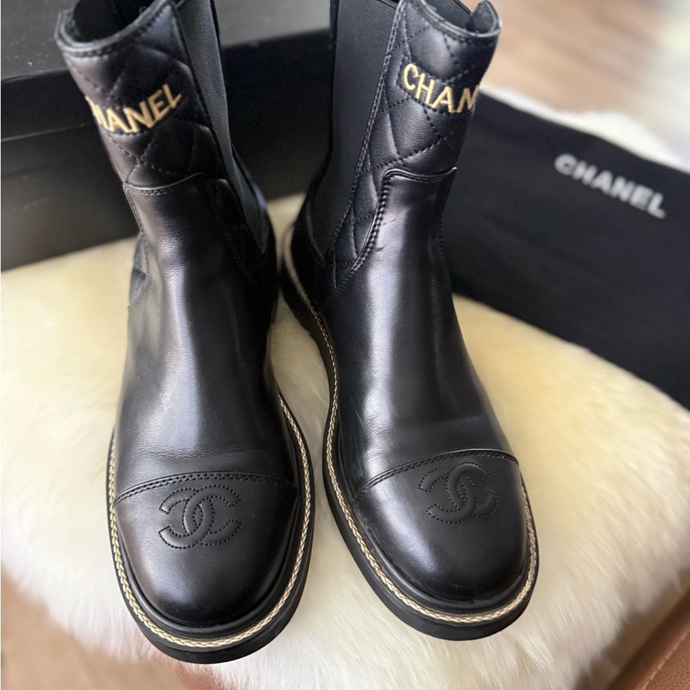 CHANEL Black Leather Mid-Calf Boots with Gold Branding